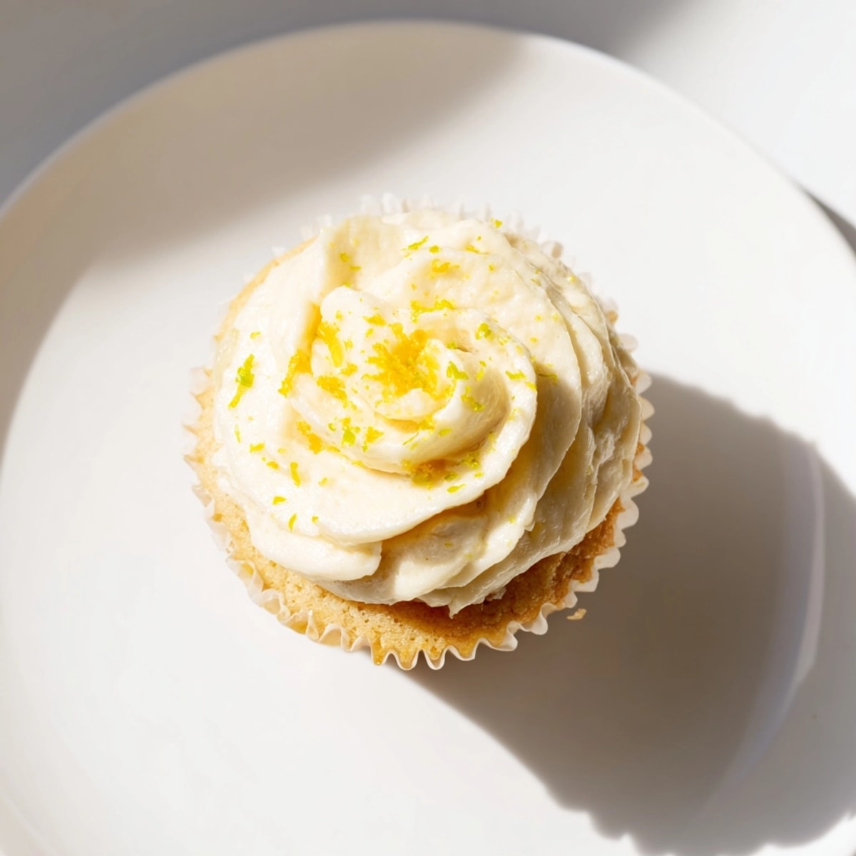 Enjoying fluffy lemon cupcakes: perfect for a sunny brunch or afternoon tea.