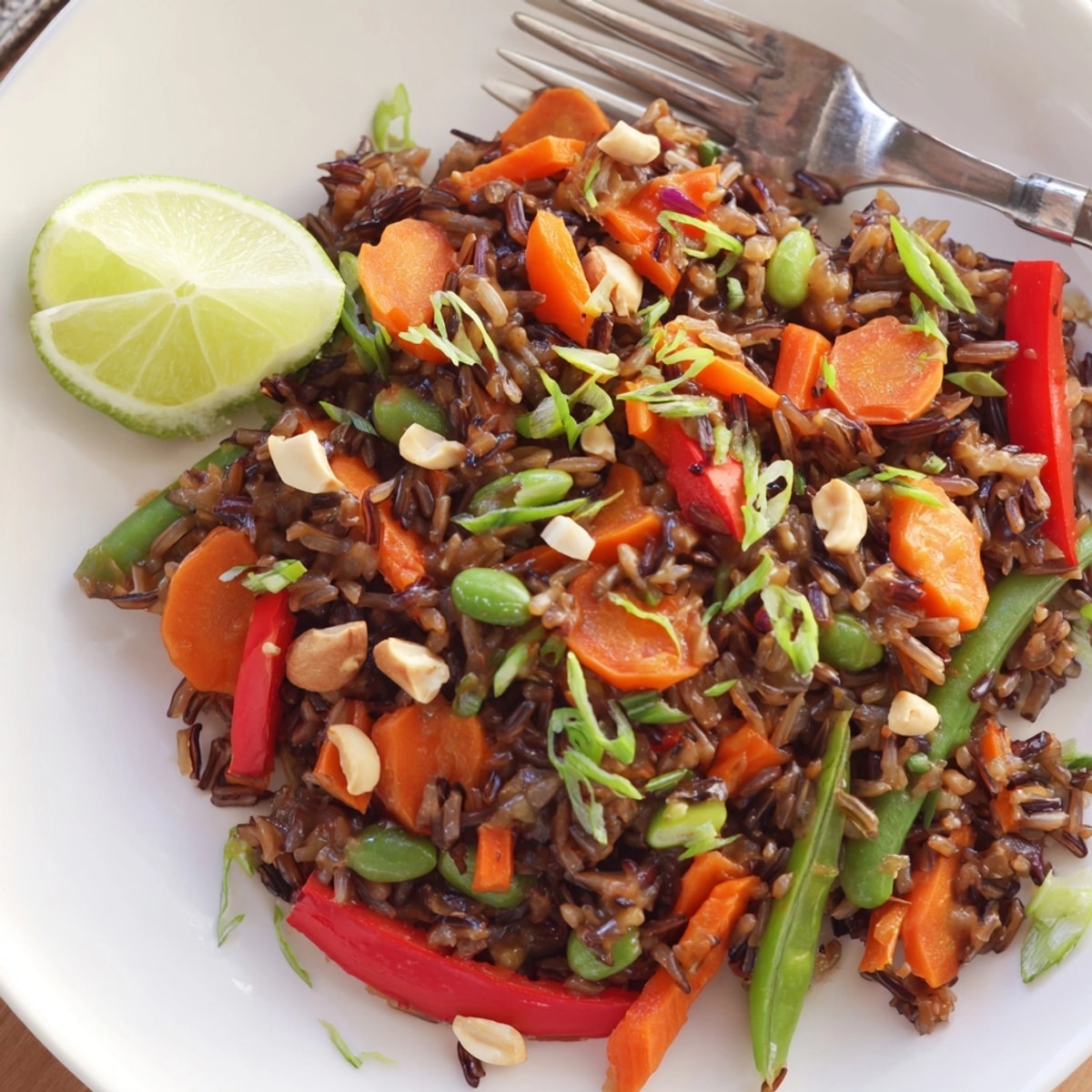 Thai Peanut Wild Rice Pilaf: a vibrant vegetarian dish with rich peanut sauce aroma.