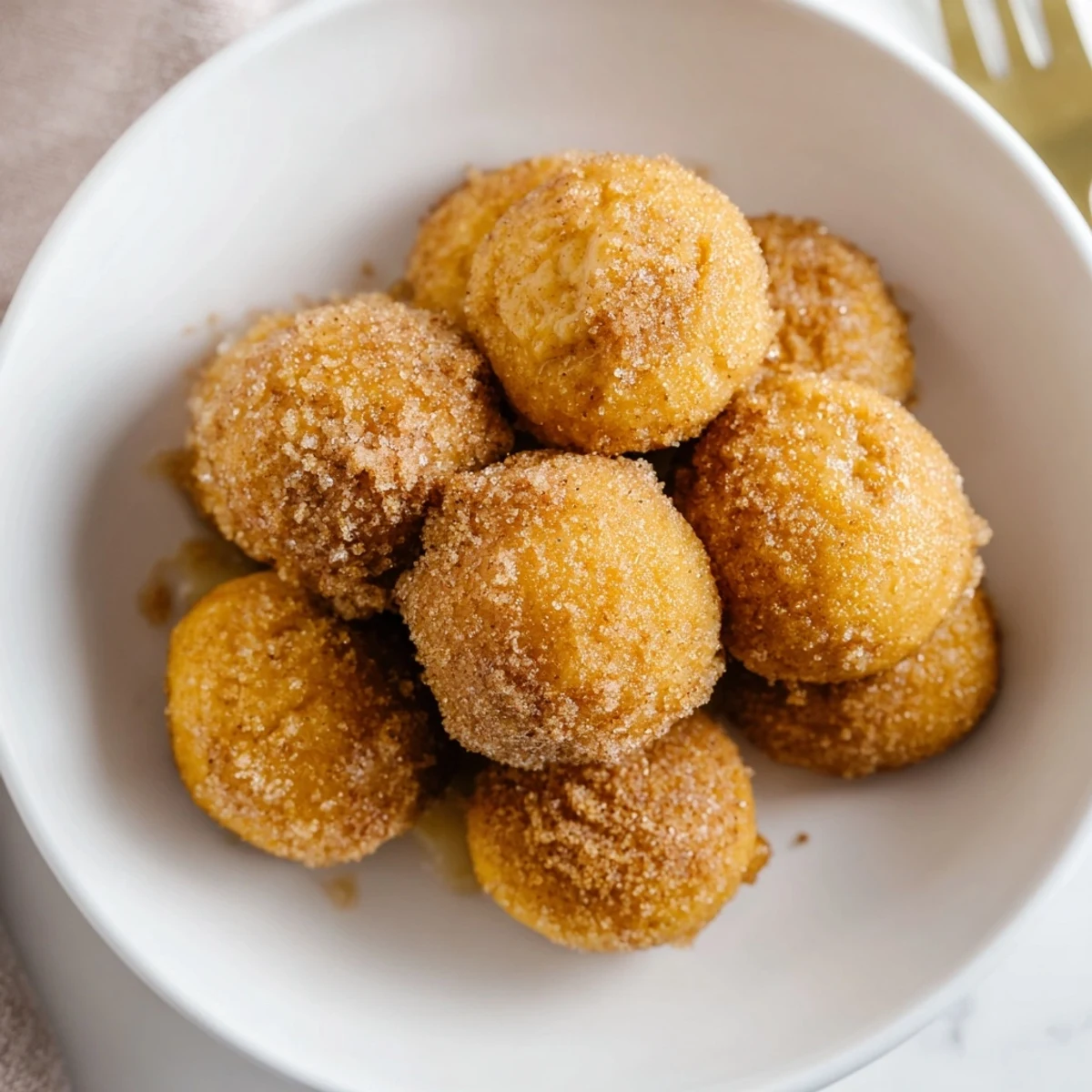 Fluffy cinnamon sugar maple bourbon pancake muffin balls, perfect for brunch gatherings.  