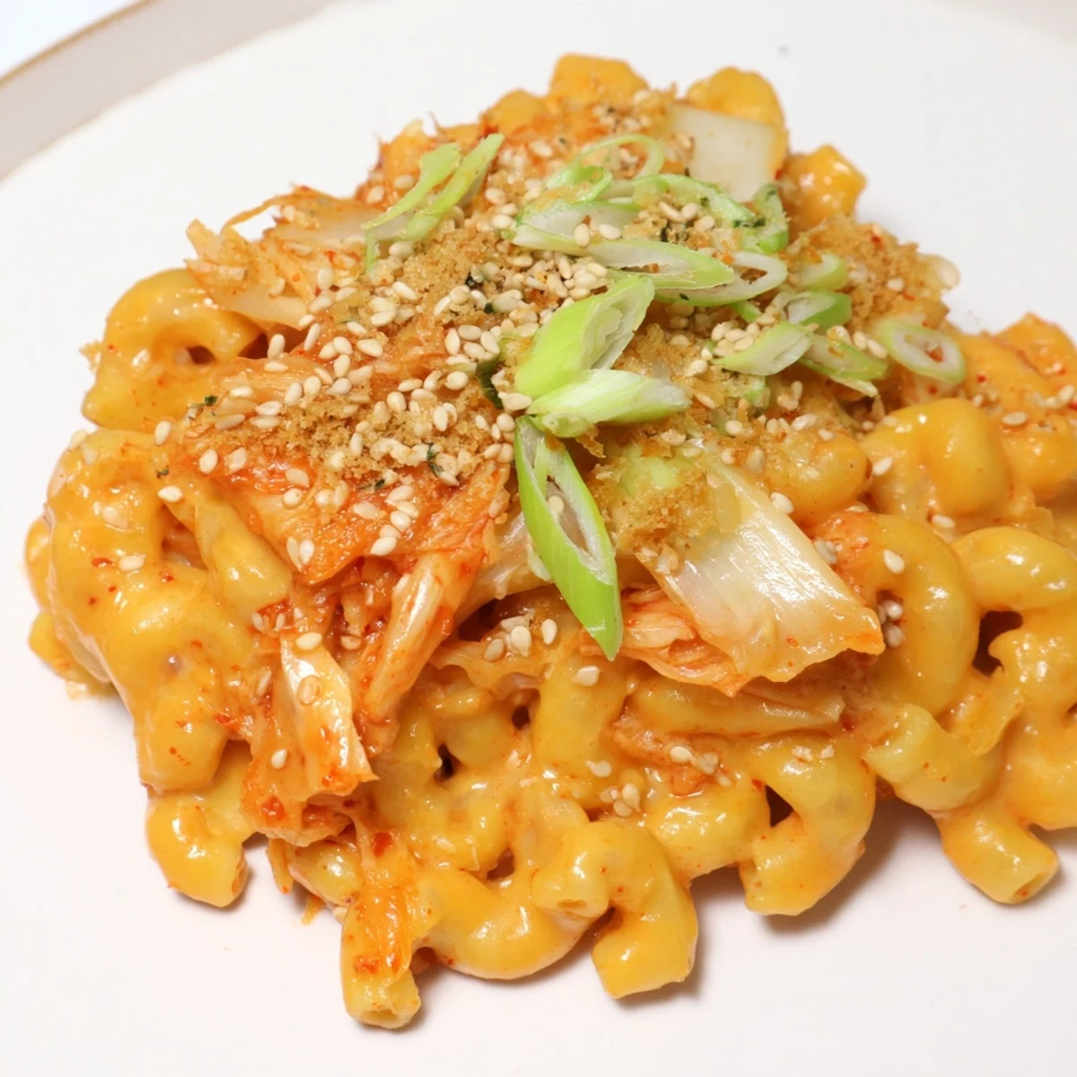 Creamy Spicy Kimchi Mac & Cheese topped with crunchy panko and sesame seeds.