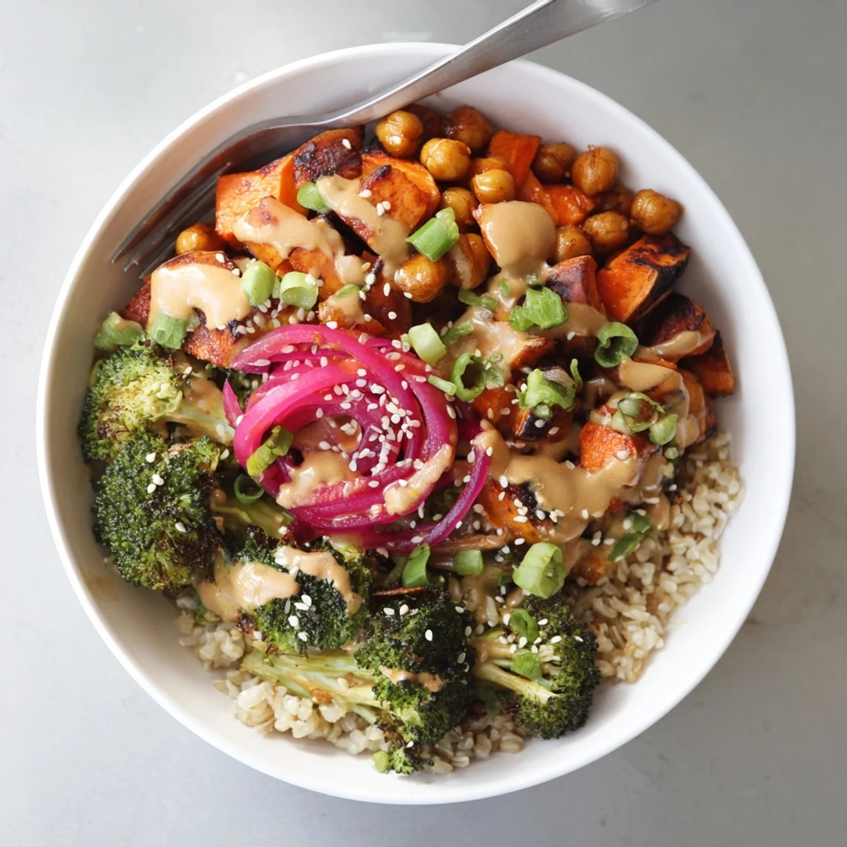 Vibrant Bold Sauce Drizzle Bowls topped with roasted veggies and creamy miso-butter sauce.