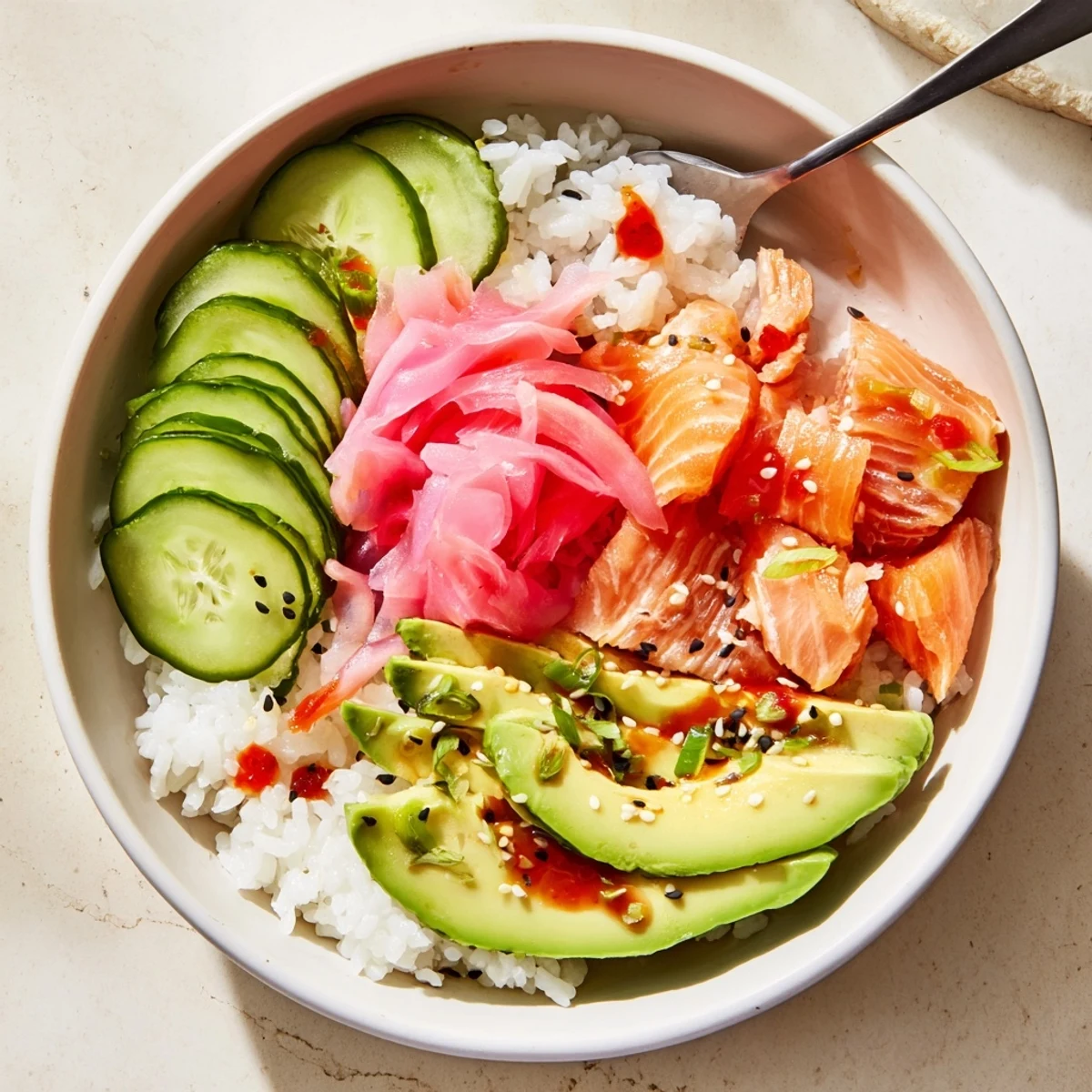 Quick and easy leftover salmon and rice bowl, drizzled with soy sauce and sesame oil.  
