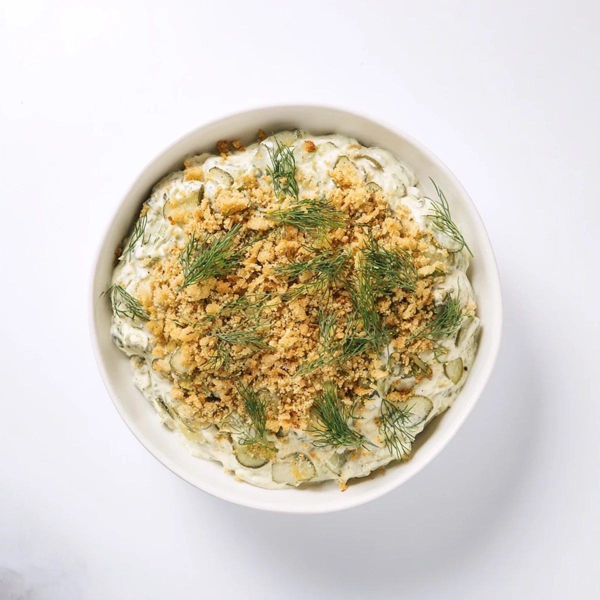 Creamy, tangy Fried Pickle Dip ready to be scooped up with your favorite chips.