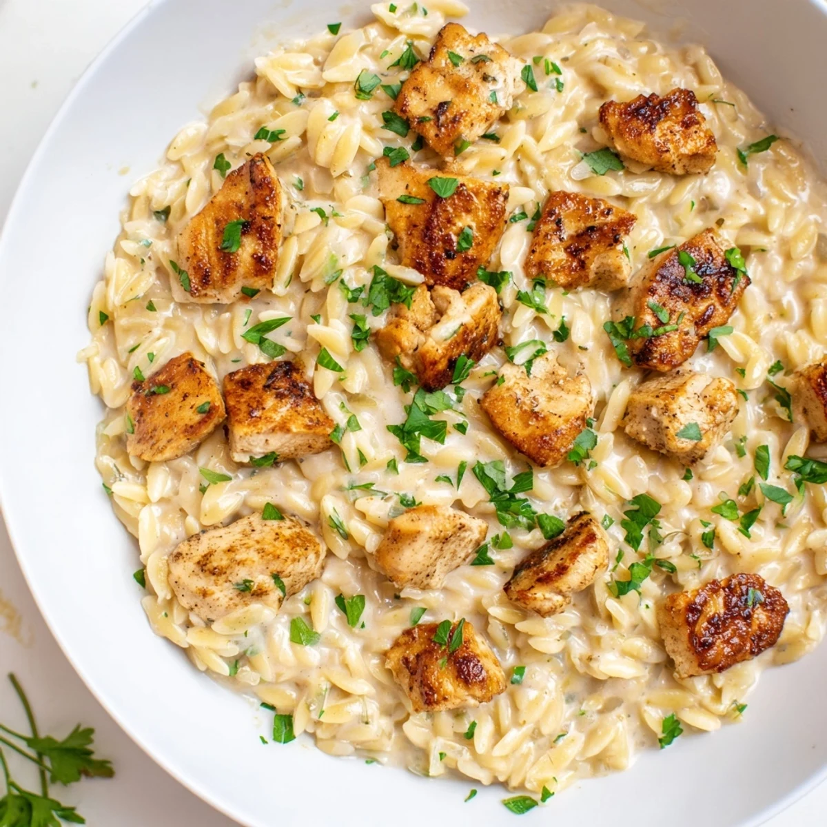 One-Pot Cajun Chicken Alfredo Orzo, a creamy skillet brimming with tender chicken and flavorful pasta.