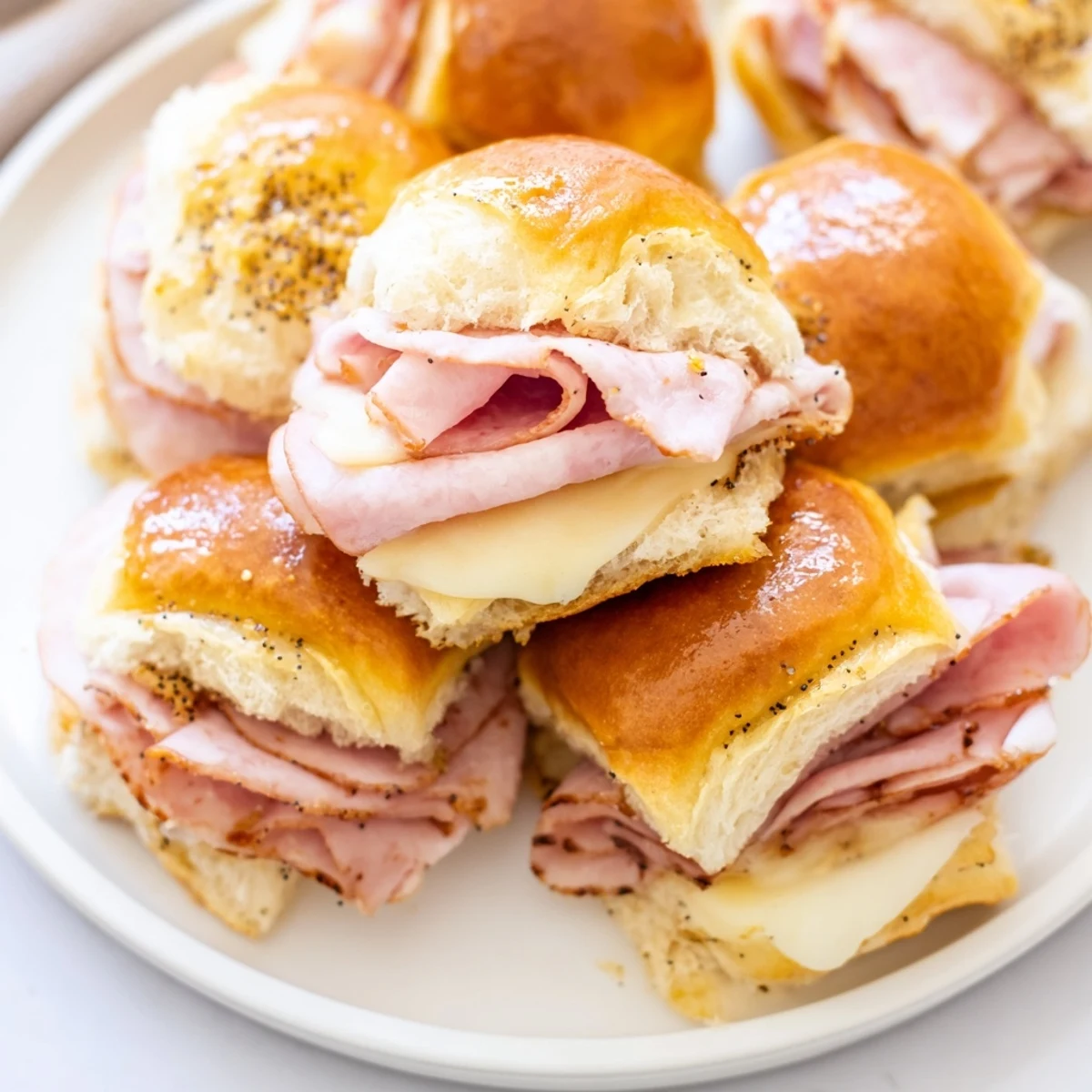 Baked Budget-Friendly Ham & Cheese Sliders, showcasing a delicious, irresistible warm snack or meal.