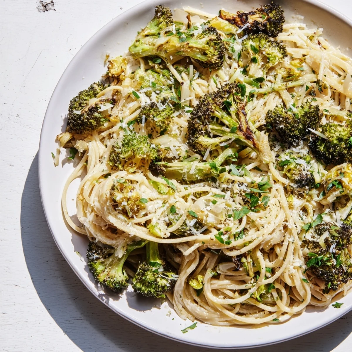Fluffy angel hair pasta with roasted broccoli, enhanced by lemon, garlic, a flavorful, light meal.