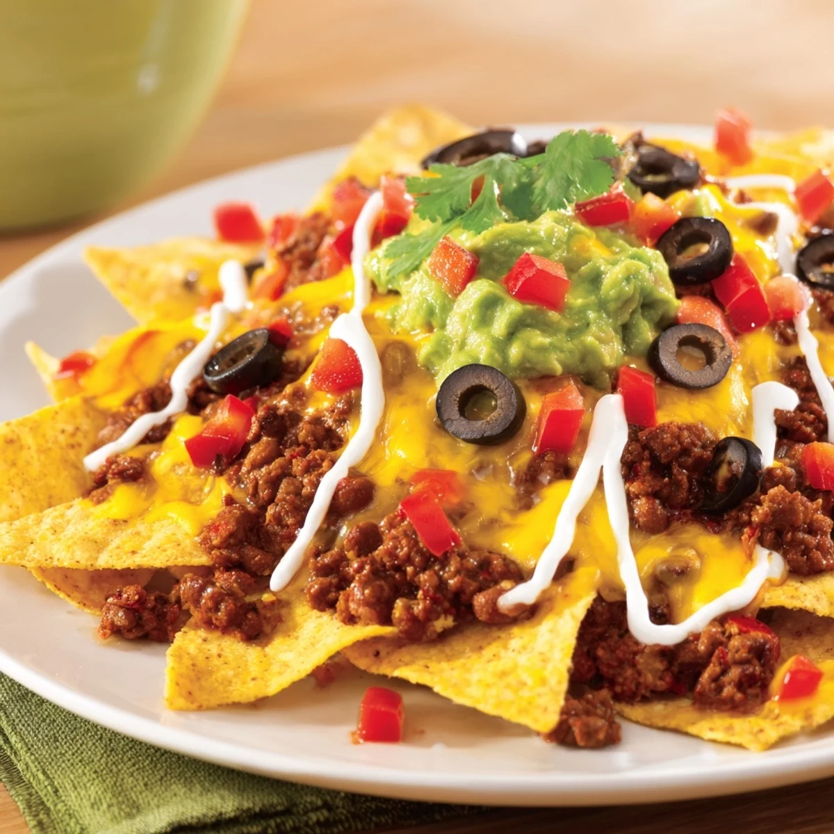 Vibrant soccer field nacho platter featuring cheesy nachos, savory beef, and colorful toppings for game day.