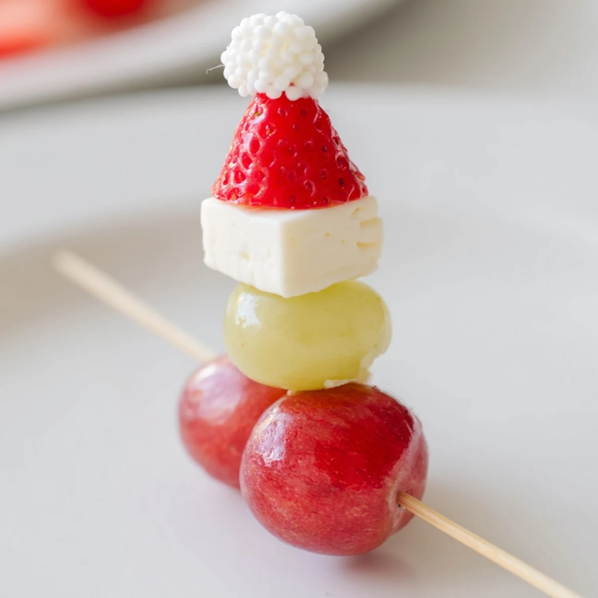 Freshly made Santa Hat Fruit and Cheese Platter, a festive appetizer loaded with grapes.