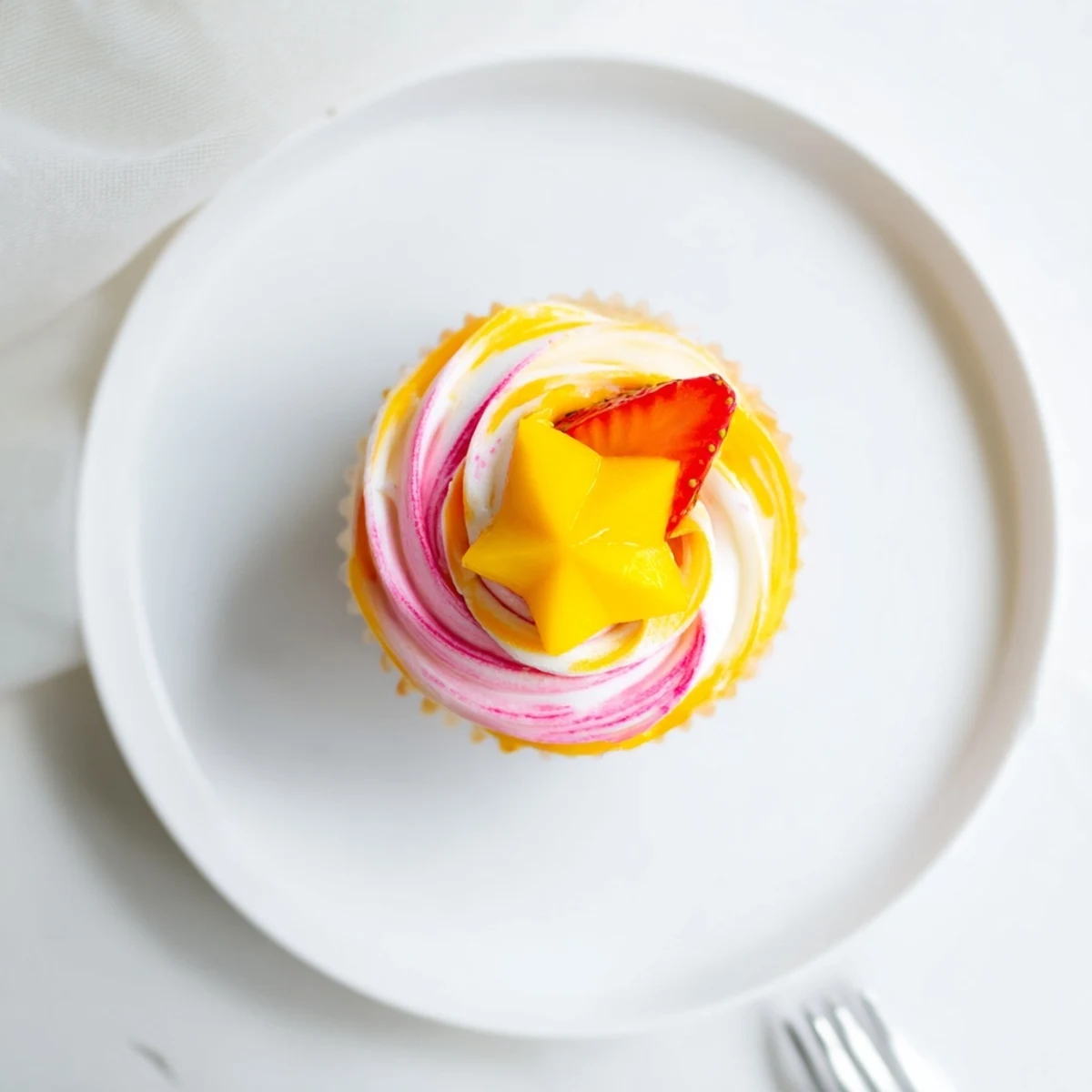 Vibrant Mango Strawberry Sunset Cupcakes, with swirled buttercream, are ready for a delicious summertime treat.