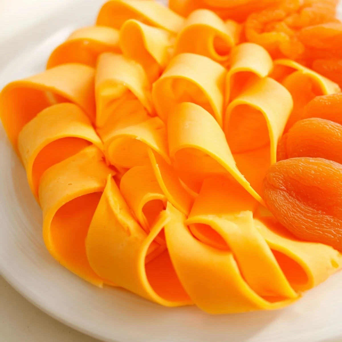 The fresh Copper Coil, a quick appetizer, showcases a beautiful cheese and apricot spiral on display.