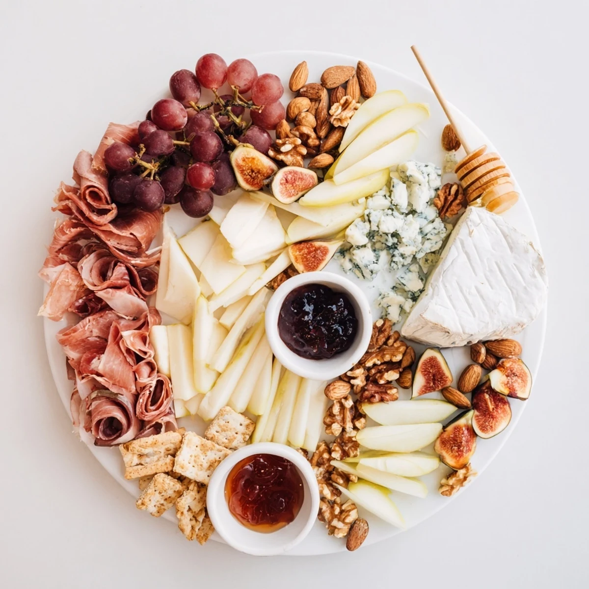 A beautifully arranged Wine & Food Pairing Platter, showcasing cheeses, charcuterie, and fresh fruits.