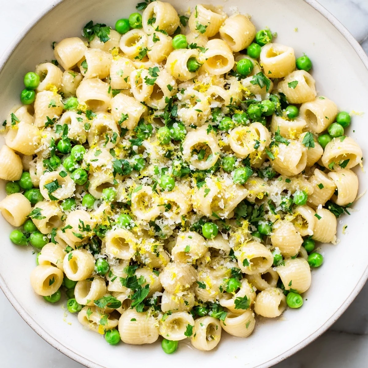 Steaming bowl of Garlic Butter Ditalini with Peas, a creamy pasta dish ready to serve.