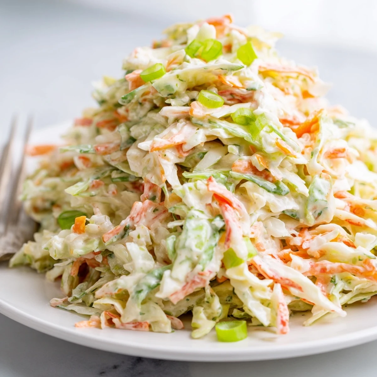 Freshly prepared Best Cabbage Coleslaw is served chilled in a rustic dish, offering a crunchy, tangy side perfect for summer barbecues and picnics.
