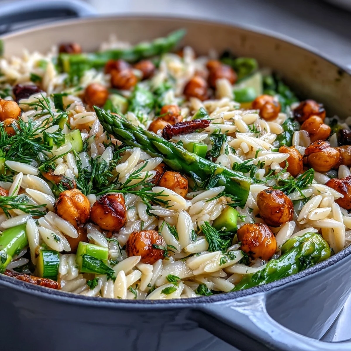 One-Pot Lemon Herb Orzo with Chickpeas and Spring Veggies in a vibrant skillet, bursting with fresh asparagus, zucchini, and herbs.