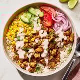 Golden Cajun Chicken Ranch Rice Bowls with creamy ranch, ready to be devoured.