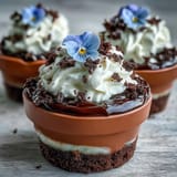Adorable Oreo dirt layered over fudgy brownies in mini pots for gifting.
