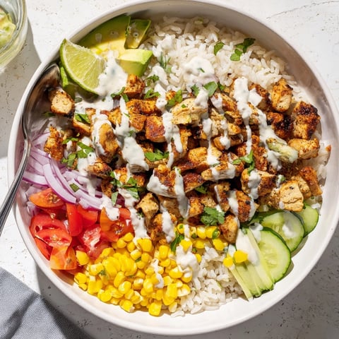 Close-up shot of vibrant Cajun Chicken Ranch Rice Bowls, a spicy, flavorful lunch.