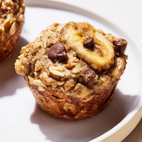 Golden brown Peanut Butter Banana Oat Muffins fresh from the oven, ready to eat.