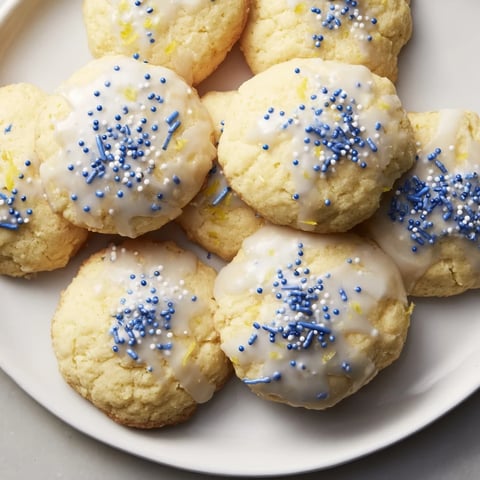Bright Festive Hanukkah Lemon Christmas Cookies drizzled with sweet glaze and sprinkles.  