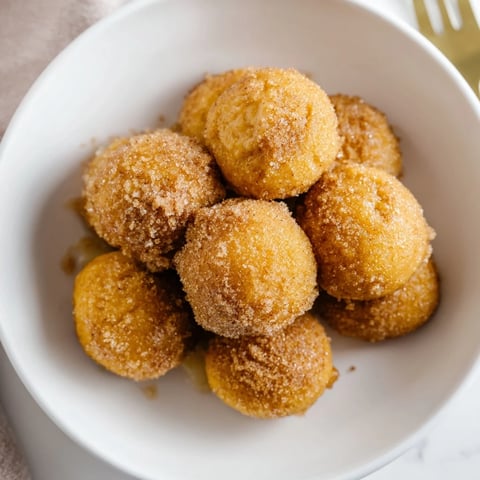 Fluffy cinnamon sugar maple bourbon pancake muffin balls, perfect for brunch gatherings.  