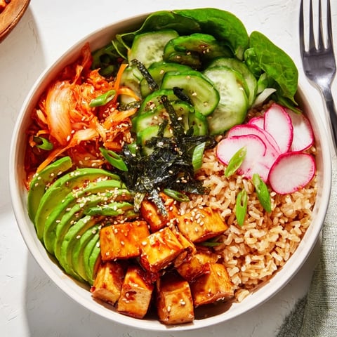 A colorful Fermented Vegetable Bowl topped with fresh veggies and tangy kimchi.  
