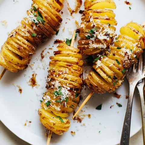 Crispy Air-Fryer Tornado Potatoes drizzled with garlic oil and seasoned spices.