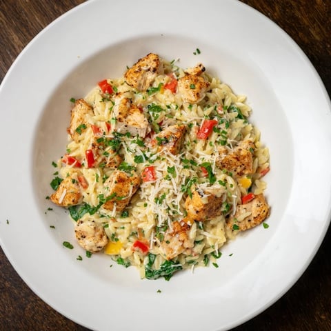 One-Pot Cajun Chicken Alfredo Orzo, a creamy, flavorful dish with golden chicken and rich sauce.