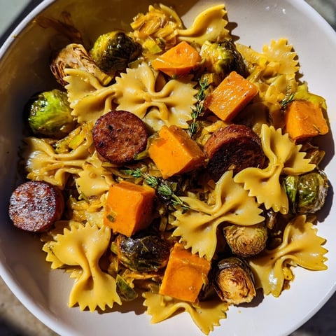 Autumn Sausage Pasta Squash, a warm dish with caramelized butternut squash, is ready to serve.