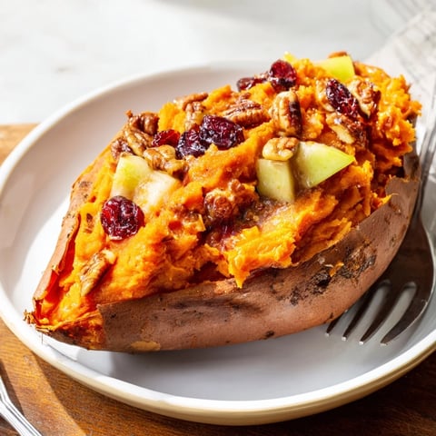 Golden-brown Cranberry Apple Twice-Baked Sweet Potatoes, a festive side dish, ready to be enjoyed.