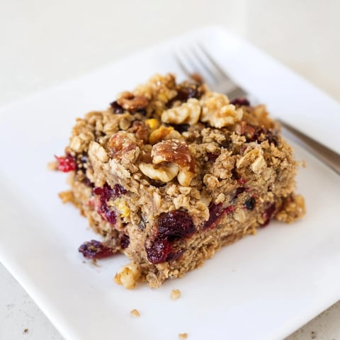 Golden, baked Matcha Cranberry Oat Crumble Breakfast Bars with a crumbly oat topping, ready to eat.