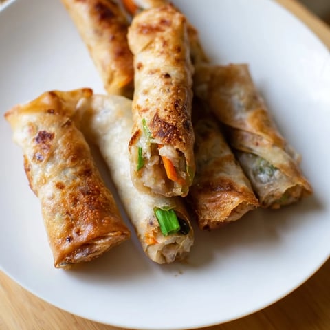 Golden-brown Air Fryer Chicken Lumpia Bites, perfectly crisp and ready to be enjoyed with dipping sauce.