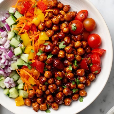 Smoky BBQ Chickpea Salad, with vibrant vegetables and a bright, tangy dressing, is ready to serve.