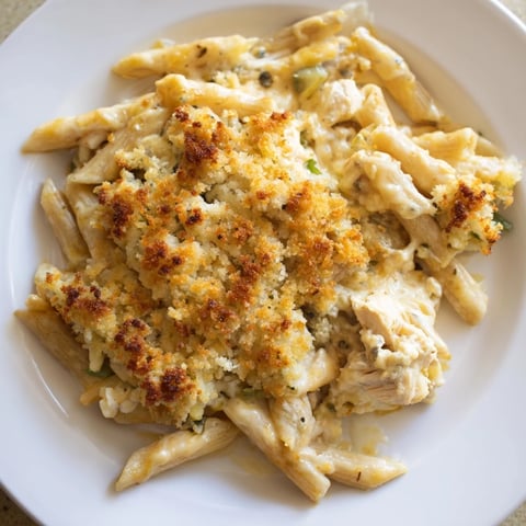 Creamy Jalapeño Popper Chicken Pasta, bubbling with melted cheese and a golden breadcrumb crust.