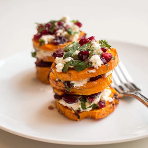 Vibrant cranberry jalapeño dip enhances these delightful sweet potato stacks for festive gatherings.  