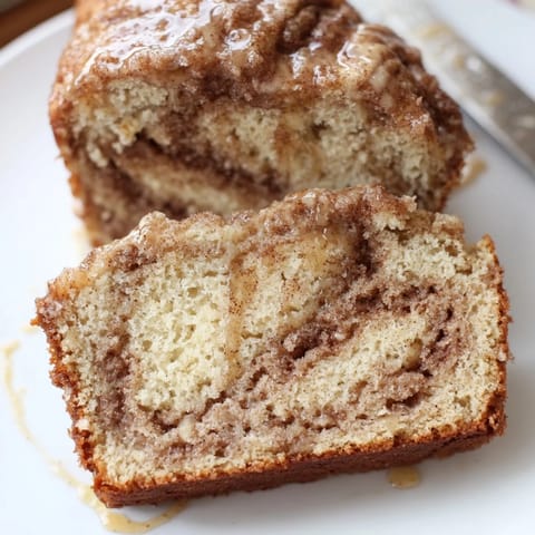 Freshly baked maple ginger cinnamon sugar pancake muffin loaf with a golden crust.  