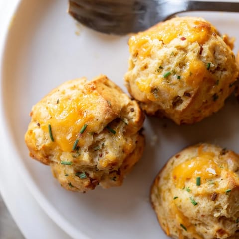Delicious Cheesy Pretzel Chili Garlic Biscuit Muffin Balls, perfect for appetizers.  