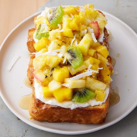 Deliciously creamy Yogurt-Custard Toast drizzled with honey and fresh fruit toppings.  