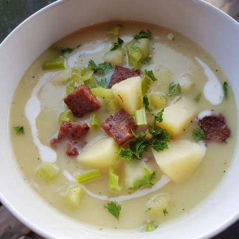 Warm and creamy Potato, Leek & Chorizo Soup, a comforting bowl perfect for a chilly evening.
