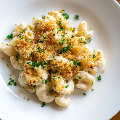 A close-up shot of rich and creamy Truffle Macaroni & Cheese, a gourmet comfort food delight.