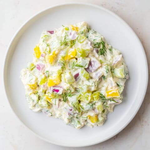 A close-up view of the vibrant Sweet and Sour Pickle Relish Dip, ready to be spread.