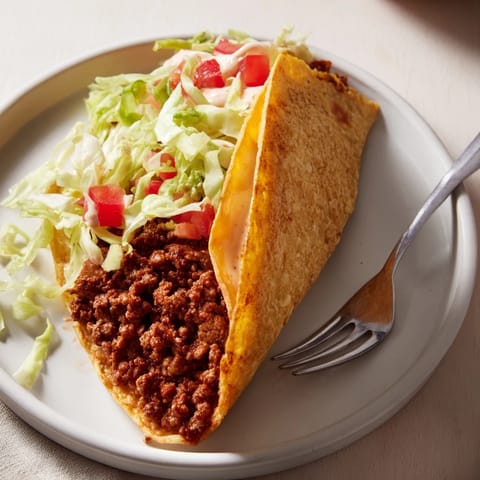 Savory Cheesy Gordita Crunch tacos with a creamy sauce served for a delicious weeknight dinner.