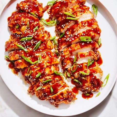 Golden-brown Sweet and Spicy Sriracha Honey Chicken, boasting a sticky, flavorful, and zesty finish.