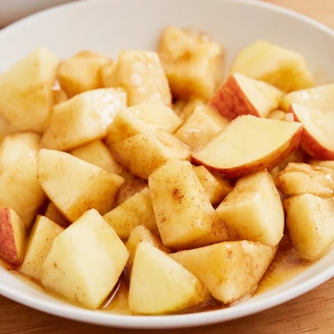 This slow cooker stewed apples recipe features tender cooked apples, perfect with vanilla ice cream.