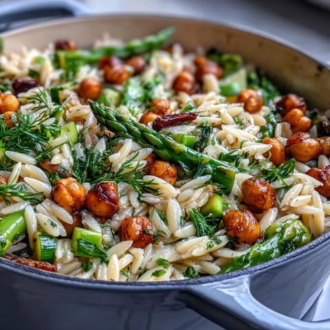 One-Pot Lemon Herb Orzo with Chickpeas and Spring Veggies in a vibrant skillet, bursting with fresh asparagus, zucchini, and herbs.