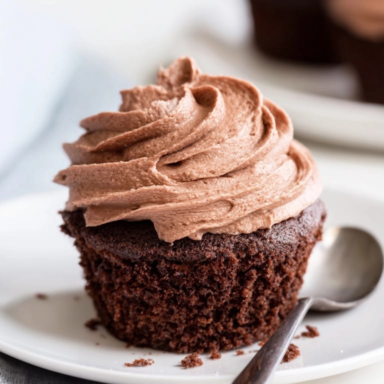 Top-down photo of decadent chocolate cupcakes: a perfect dessert, ready for frosting and sharing.