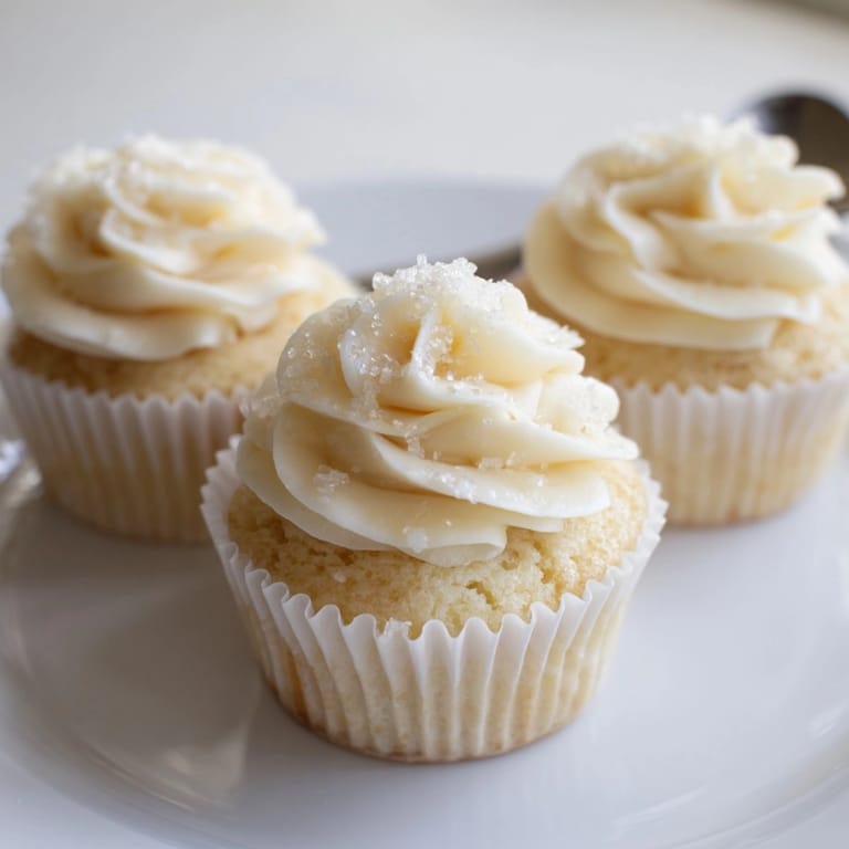 Homemade vanilla cupcakes, a classic American dessert, ready for frosting and sharing.