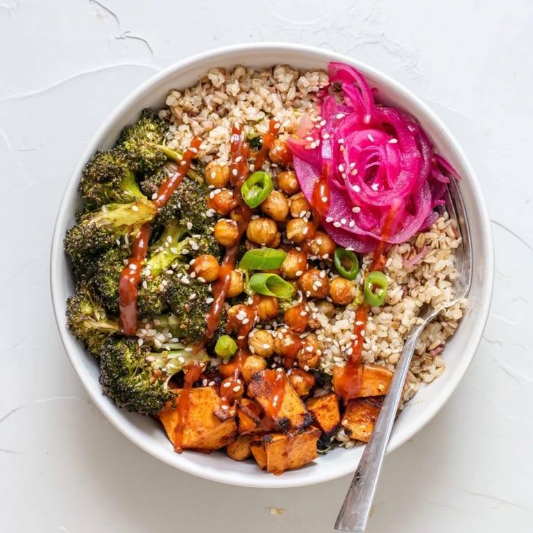 Colorful grain bowls featuring gochujang-maple sauce and crisp roasted sweet potatoes.