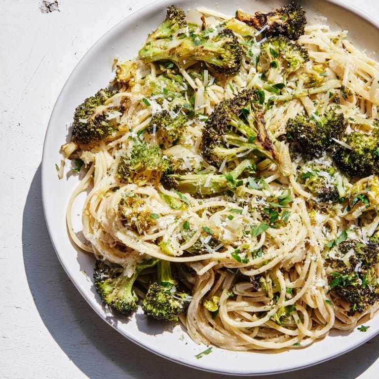 Fluffy angel hair pasta with roasted broccoli, enhanced by lemon, garlic, a flavorful, light meal.