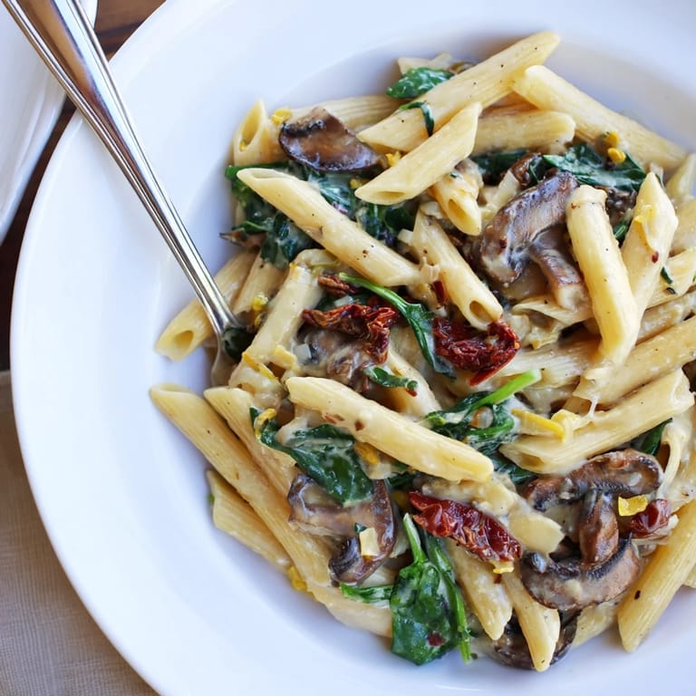 Golden mushrooms and vibrant tomatoes dance in this creamy sun-dried tomato mushroom penne skillet.