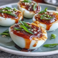Spicy miso marinated eggs with soft, creamy yolks in a savory umami sauce.  